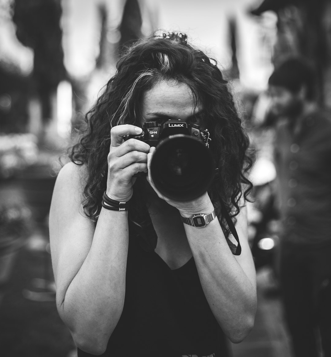 Portrait of a young Danish female photojournalist smiling